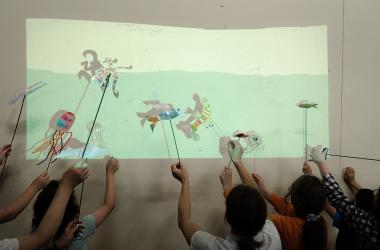 Image of children with shadow puppets