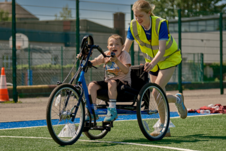 A young boy in a hypocamp chair