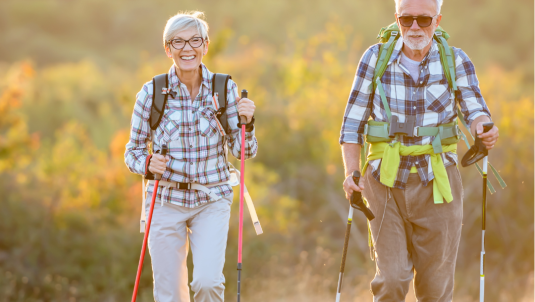 2 people walking with activator poles