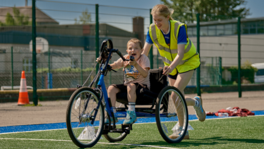 girl on bike at sports ability day