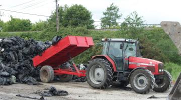 Photo of tractor unloading rubbish